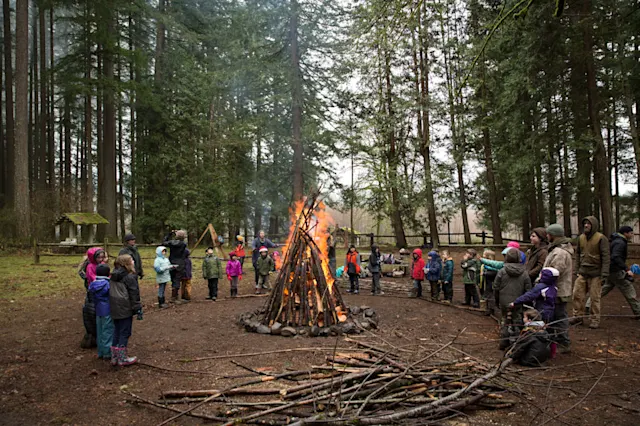 Kids and Guides around a winter bonfire
